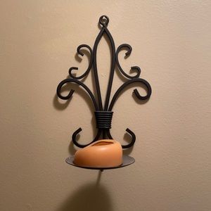Wall candle holders.